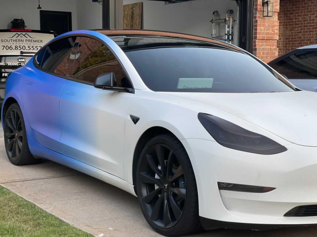 Gloss vinyl wrap on a sports coupe